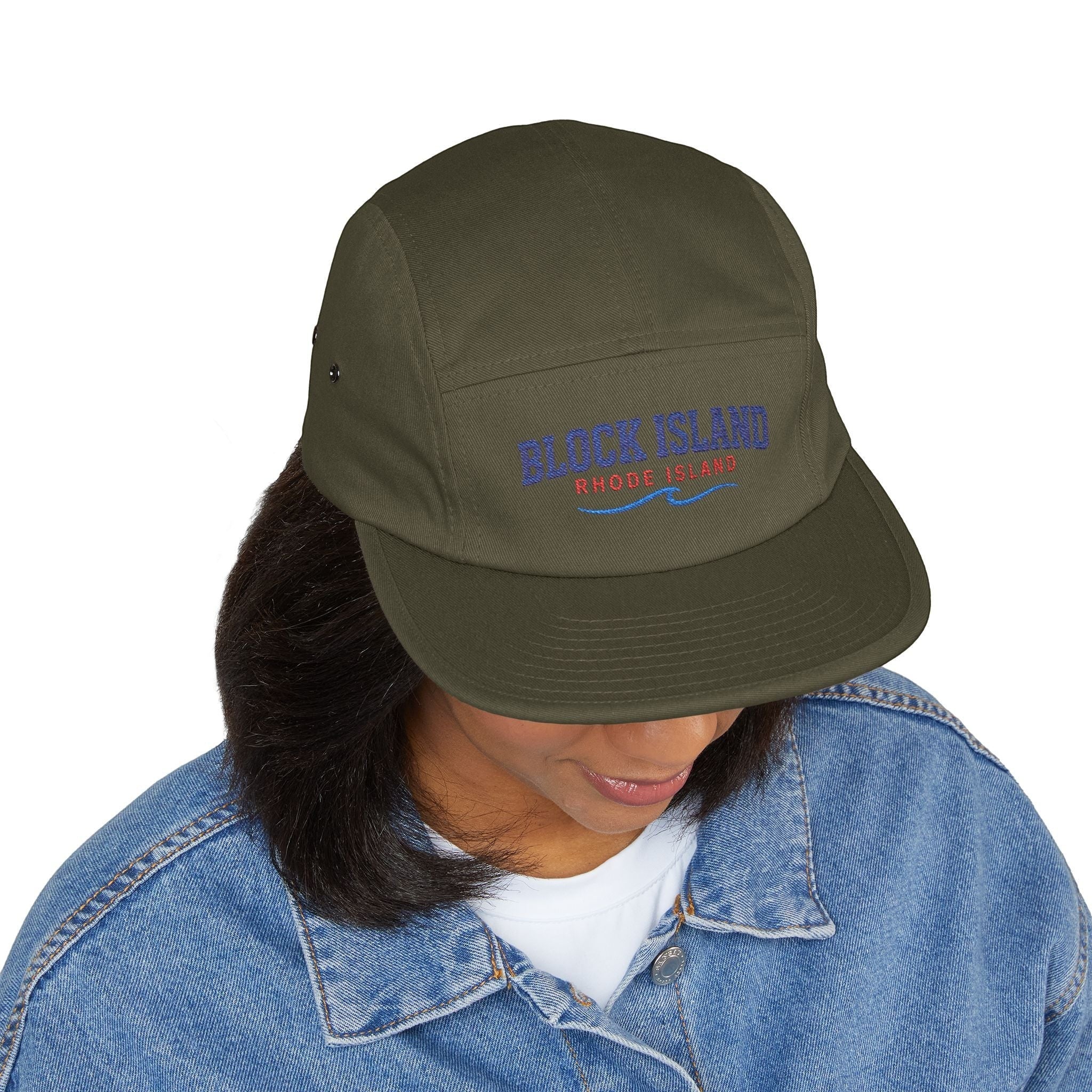 BlockBoundRI olive green 5-panel cotton cap with Block Island Rhode Island embroidery worn by a person in denim