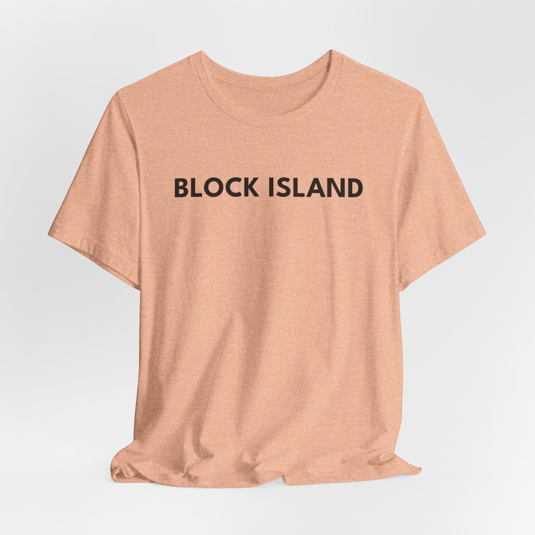 BlockBoundRI peach-colored crew neck t-shirt with BLOCK ISLAND printed in minimalist black text on the chest.
