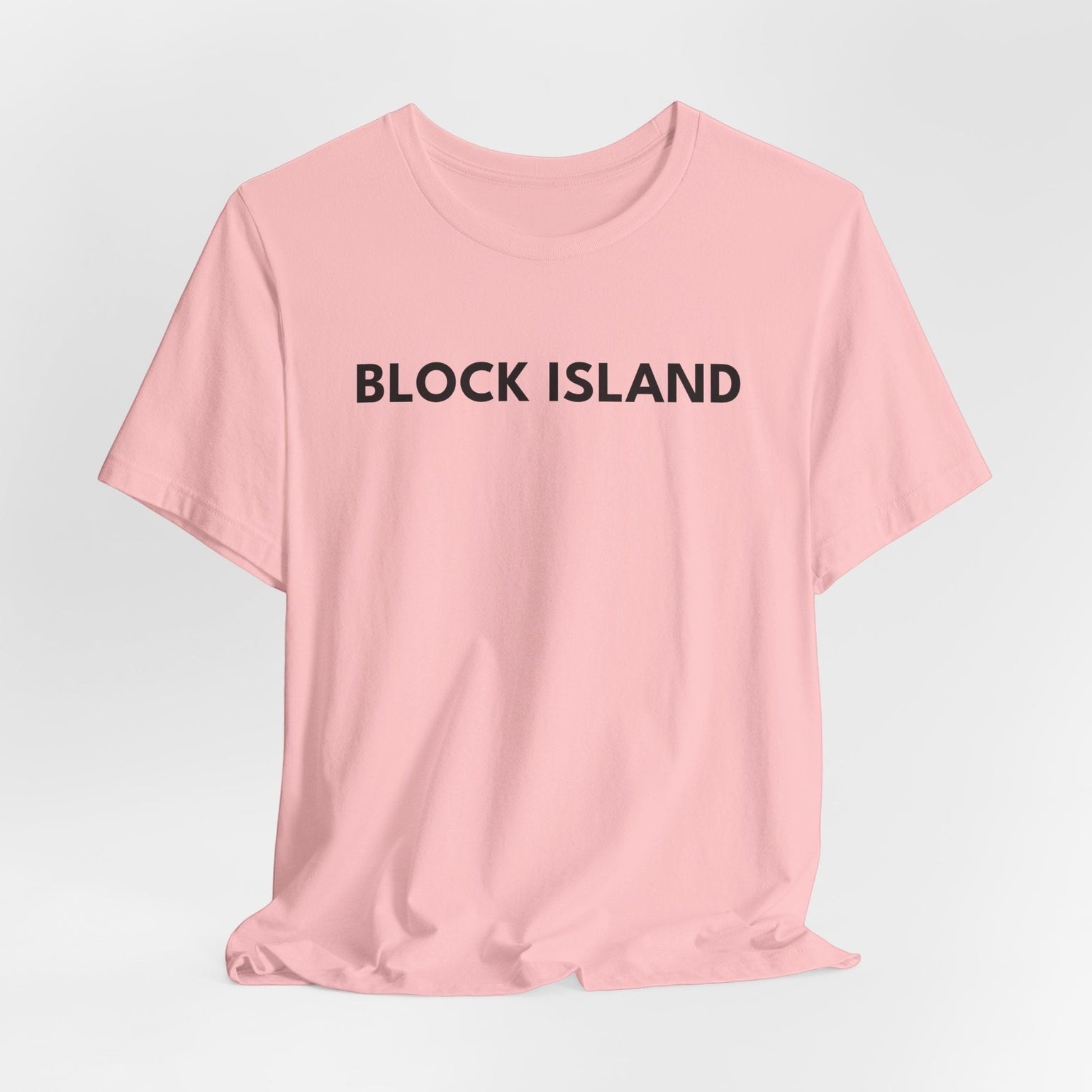 BlockBoundRI light pink cotton t-shirt with BLOCK ISLAND text printed on the chest in minimalist black lettering.