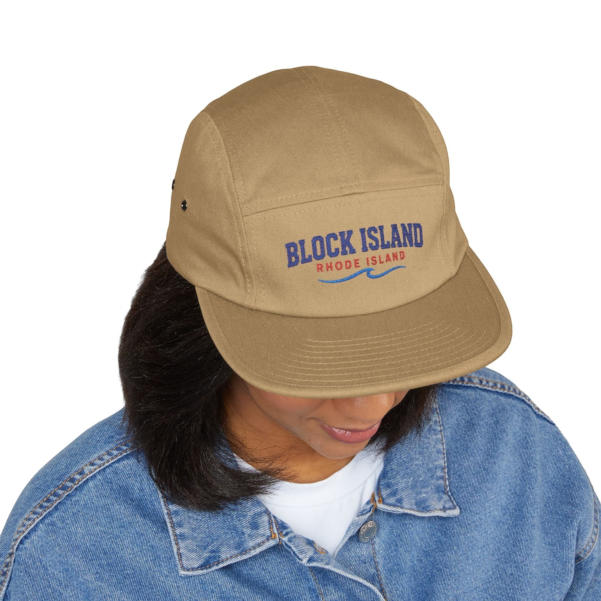 BlockBoundRI tan 5-panel cotton cap with Block Island Rhode Island wave embroidery worn by a person in a denim jacket