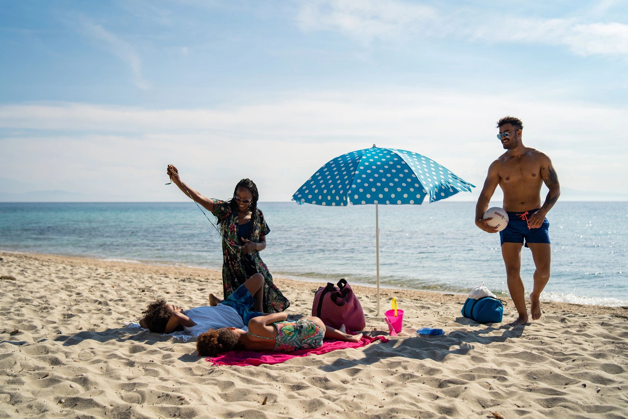 People enjoying a sunny beach day for a coastal lifestyle feel
