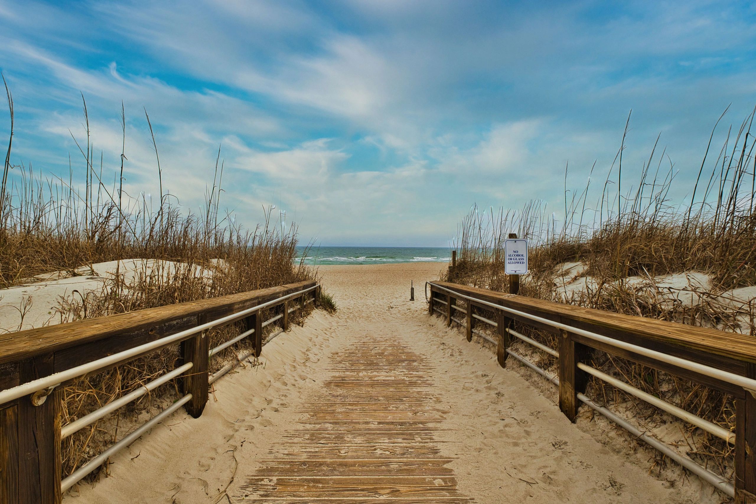 Coastal boardwalk leading toward the beach