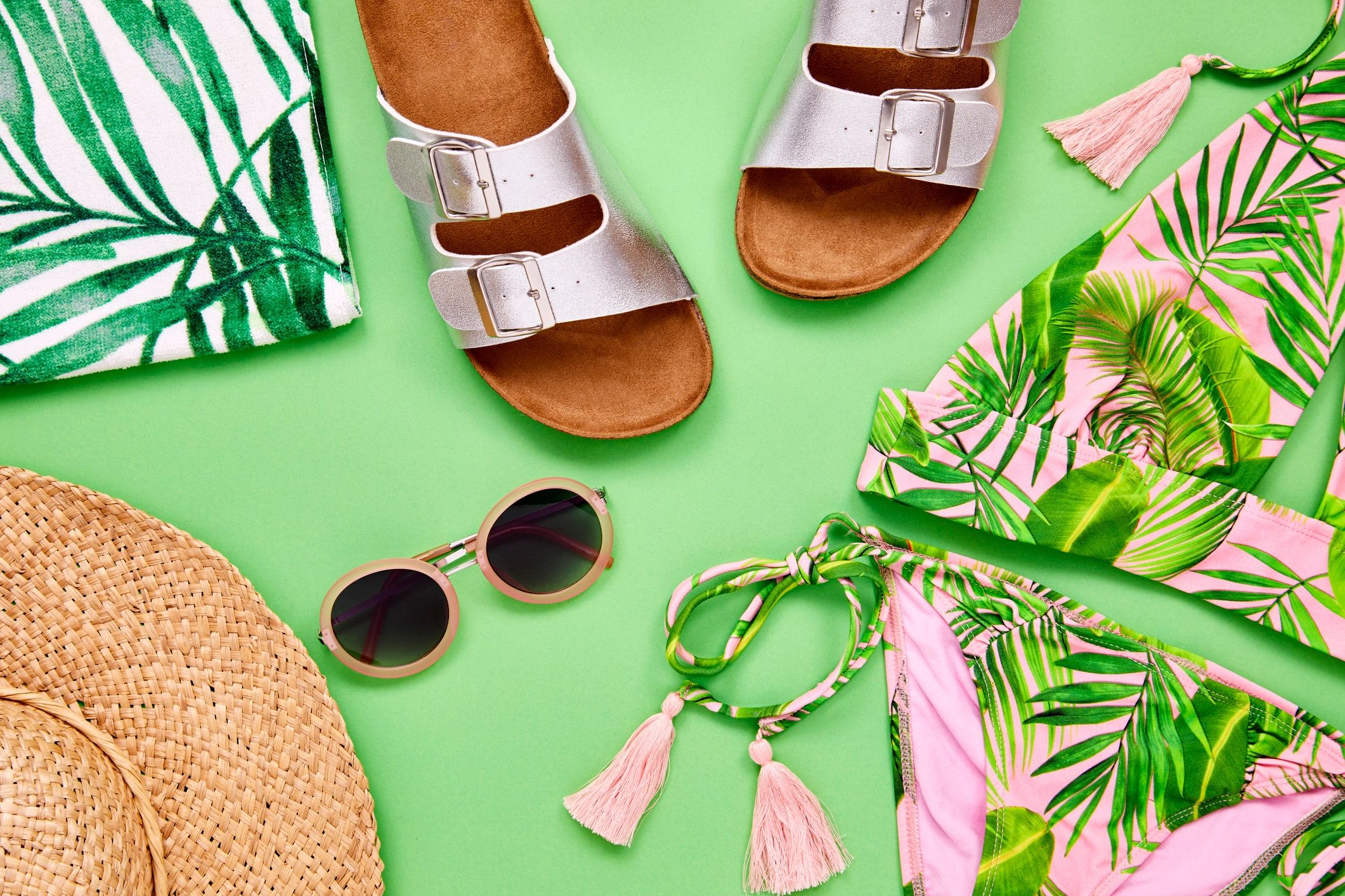 Flat lay of summer clothing and accessories with a coastal feel